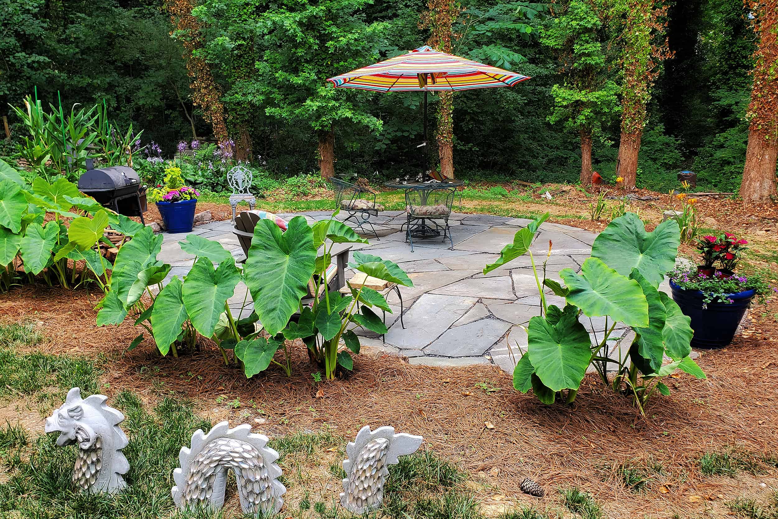Lawrenceville landscaping with flagstone patio with whimsical garden art