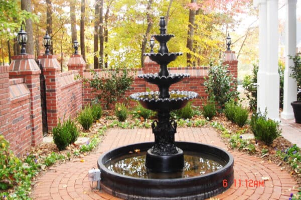 New Orleans style cast iron fountain in brick walled courtyard garden Braselton 1