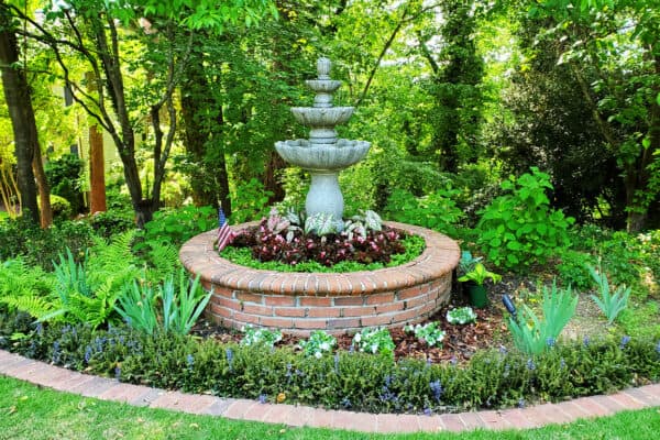 Traditional 3 tiered fountain in woodland garden Atlanta