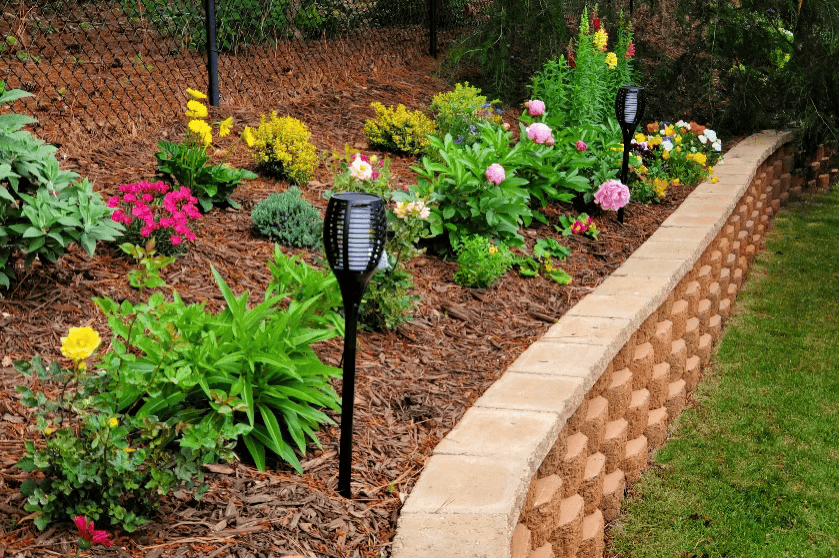 Finished Knee Wall with Homeowner’s Flower Plantings